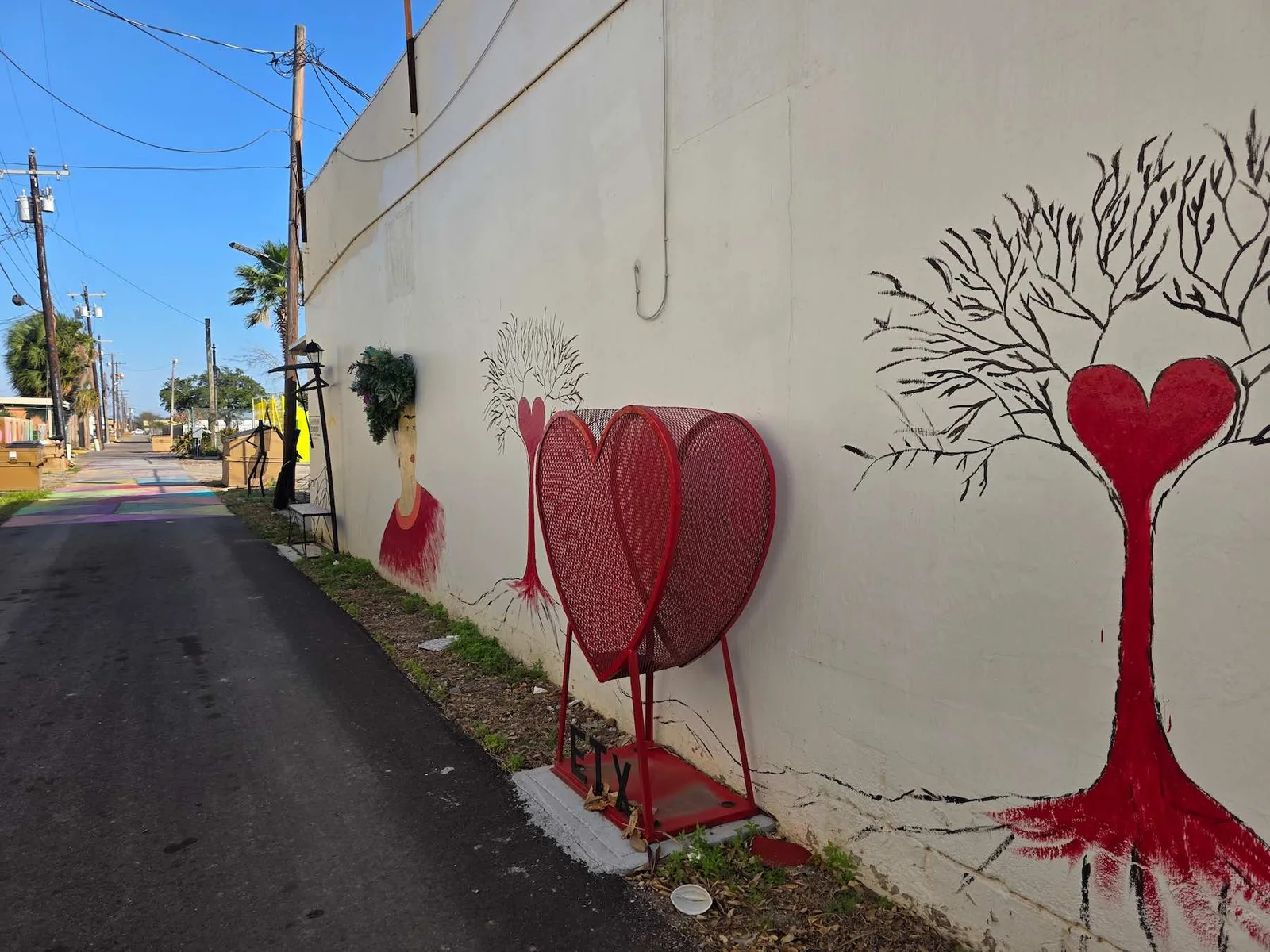Leadership Alley at Society 204 with a red heart mural