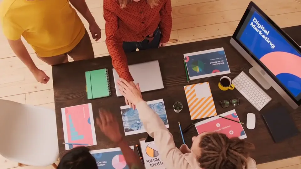 Overhead conceptual view of coworkers gathering around a shared table